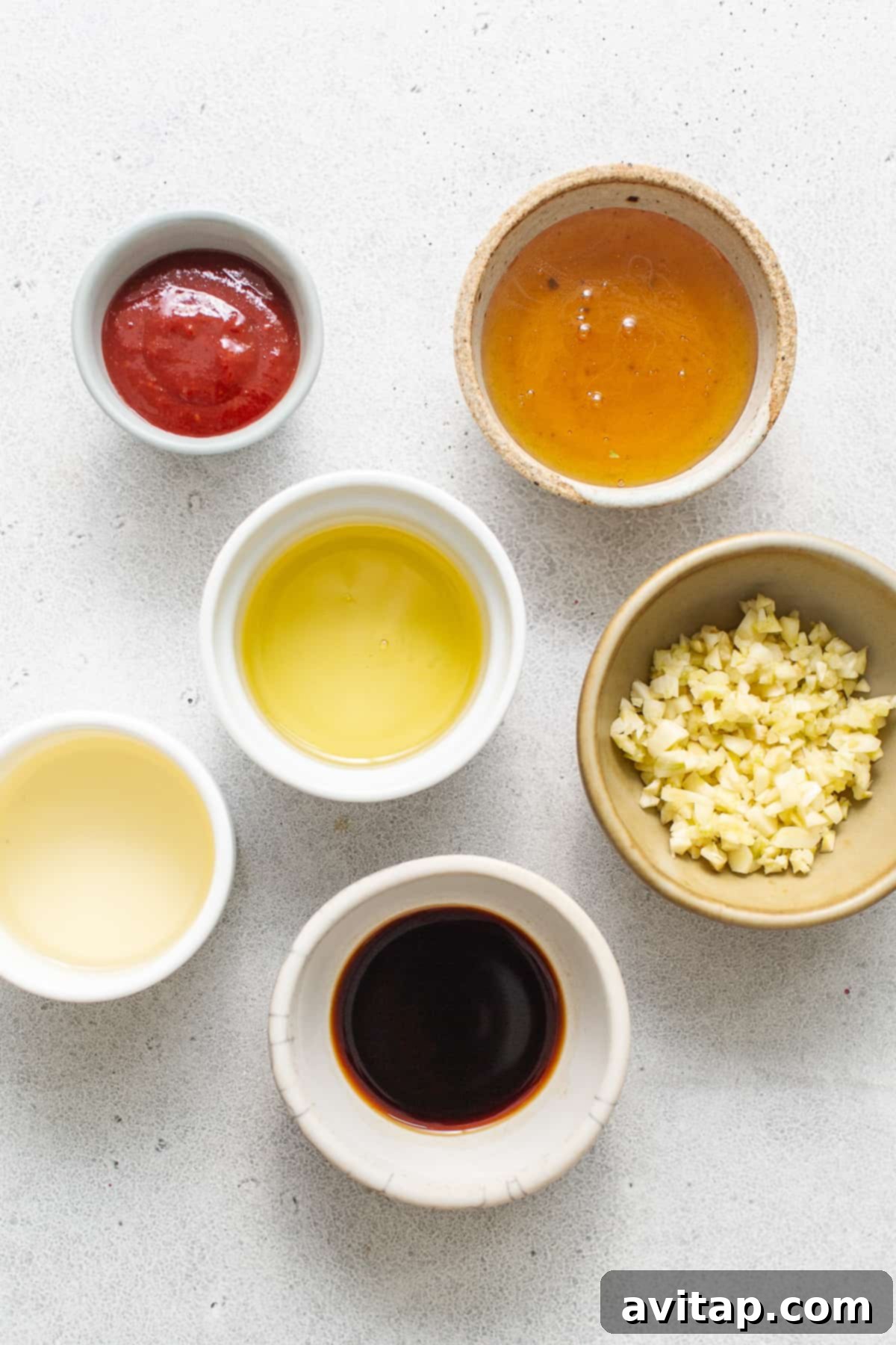 Key Marinade Ingredients for Spicy Garlic Prawns Bowls showcasing key ingredients for the spicy garlic prawn marinade, including gochujang, honey, and soy sauce.