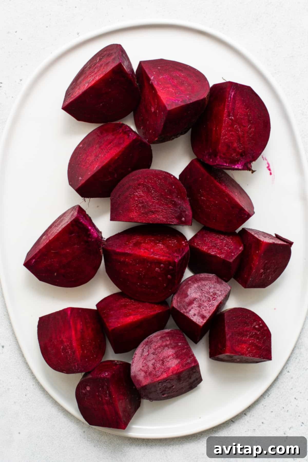 Perfectly sliced roasted beets, showcasing their tender texture and vibrant color.
