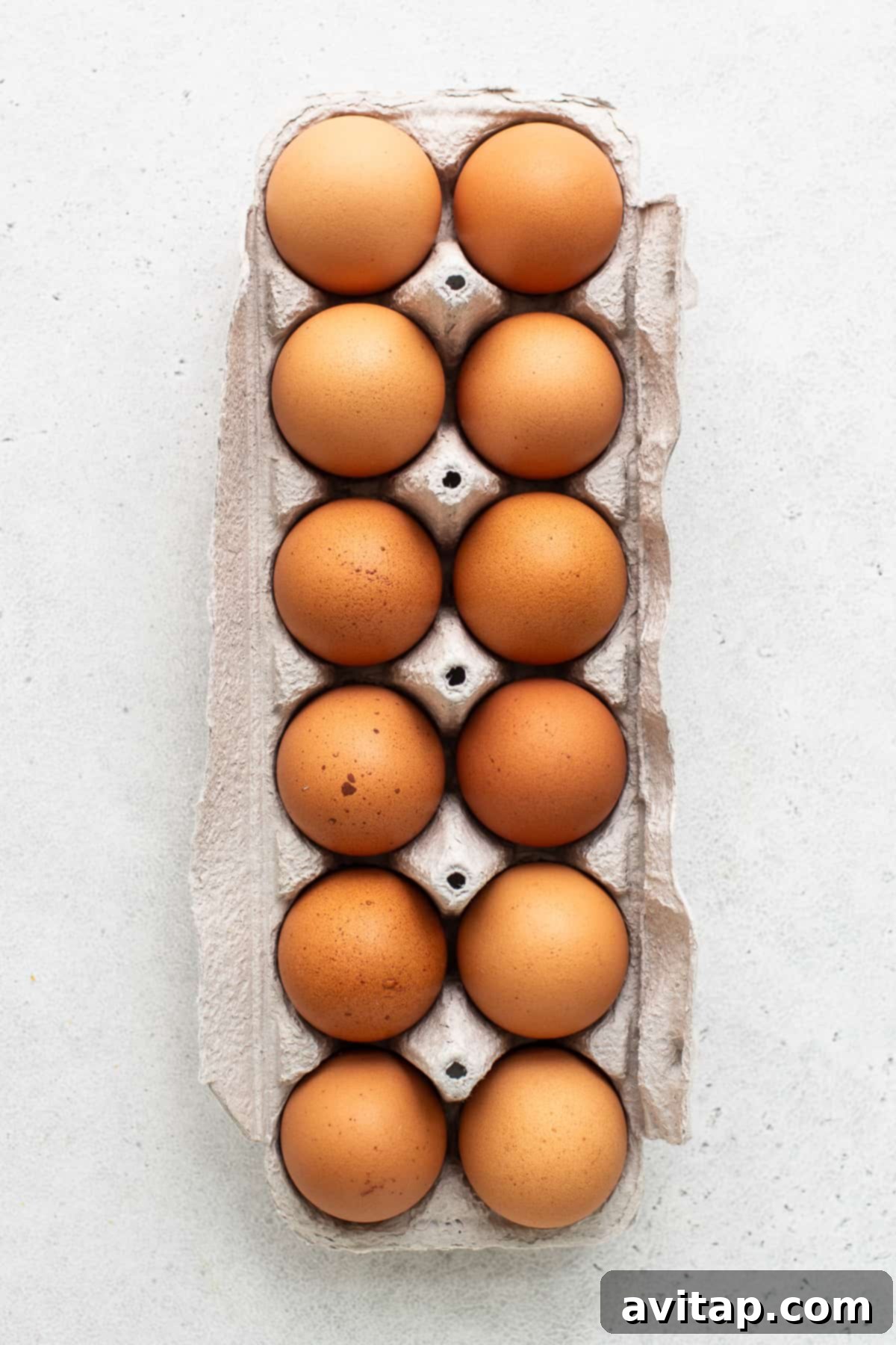 A carton of fresh large eggs, ideal for making air fryer hard boiled eggs.