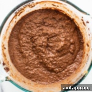 Chocolate batter setting in a glass bowl.