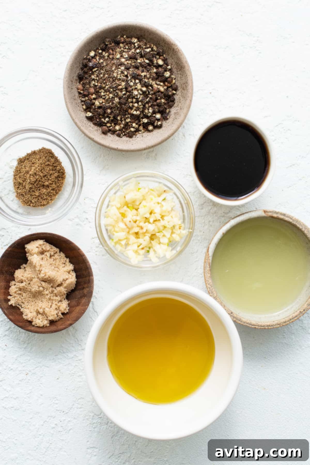 Individual bowls showcasing the simple yet powerful ingredients for a delicious skirt steak marinade.