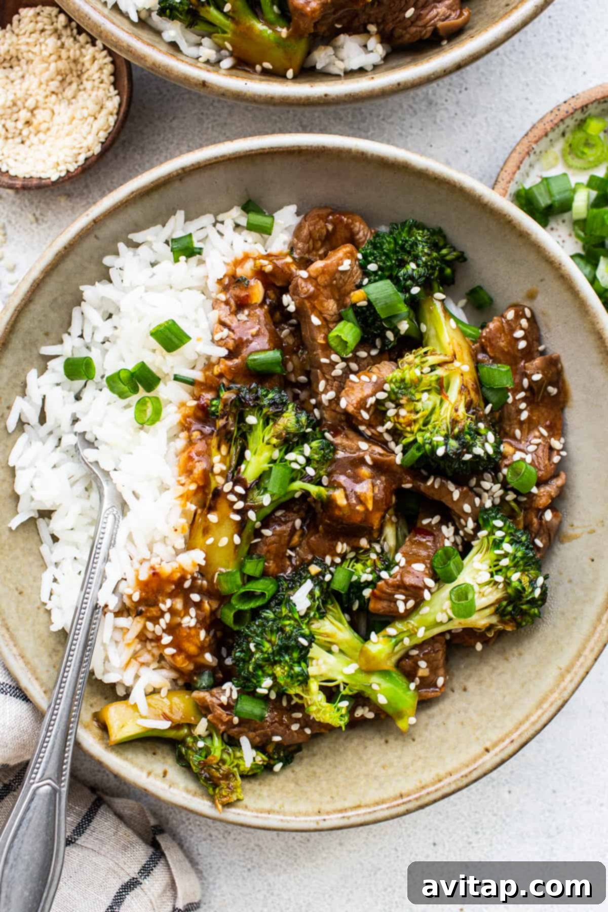 A bowl of fresh beef and broccoli stir fry, ready to be enjoyed.