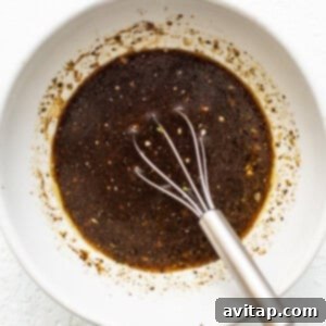 Marinade ingredients whisked together in a bowl.