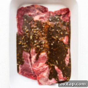 The Perfect Skirt Steak Recipe 5 Skirt steak with marinade in a dish.