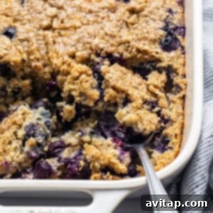 Blueberry muffin oatmeal bake in a casserole dish, topped with streusel.