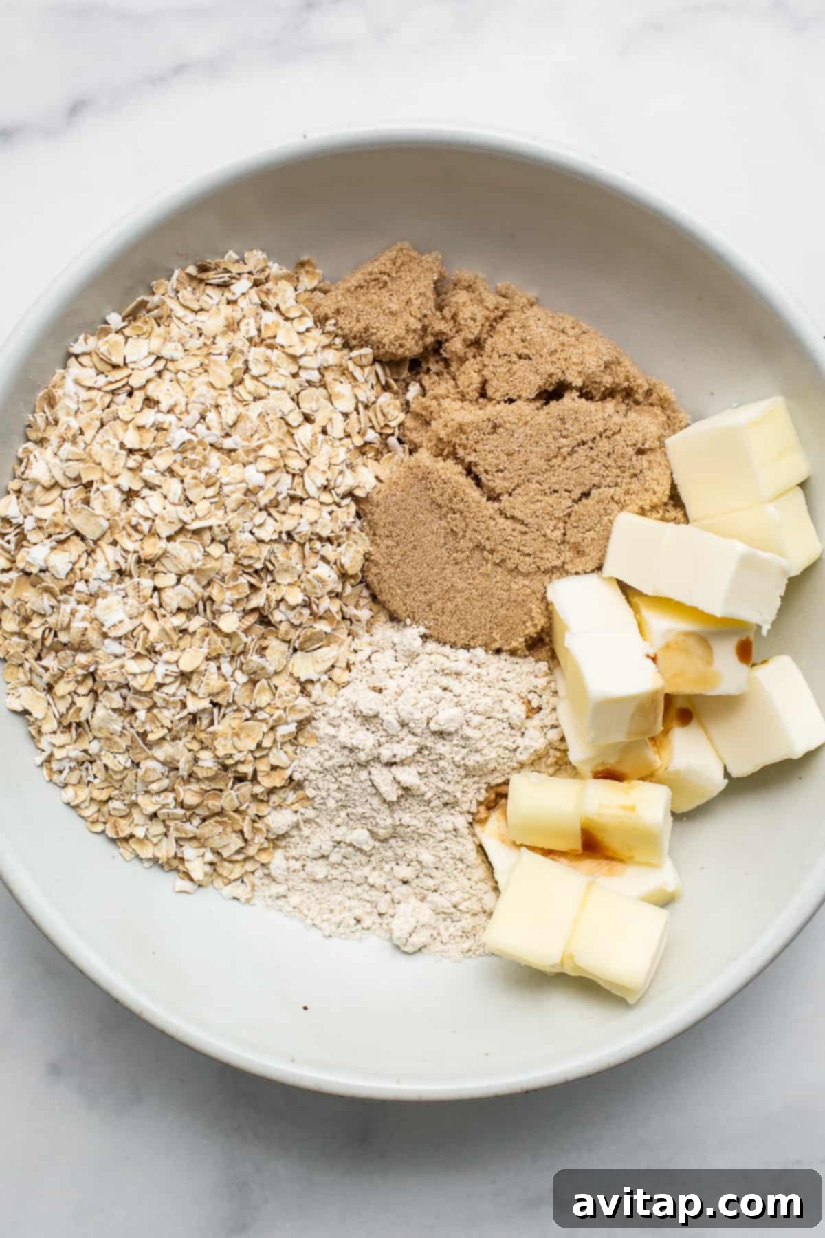 Ingredients for streusel topping: oats, flour, brown sugar, and cold butter.