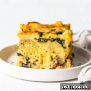 A perfect slice of breakfast strata served on a plate.
