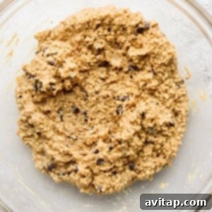 Collagen cookie dough being mixed in a bowl.