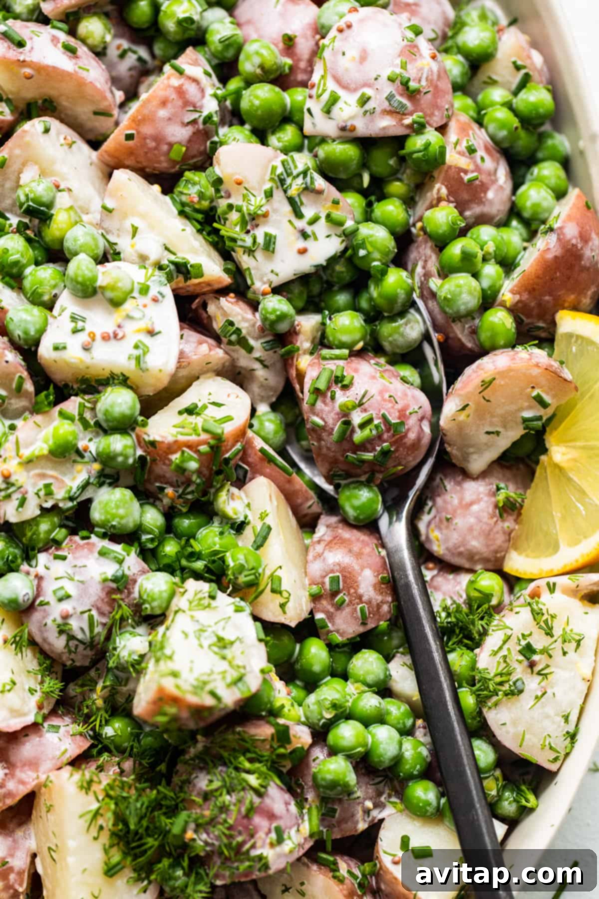 English pea potato salad on a spoon.