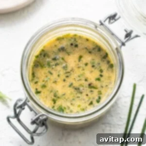 Hummus dressing in a jar, ready to be poured.