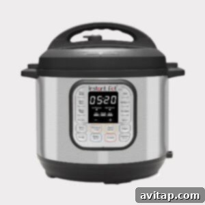 An Instant Pot pressure cooker on a clear background, showcasing its sleek design and readiness for cooking.
