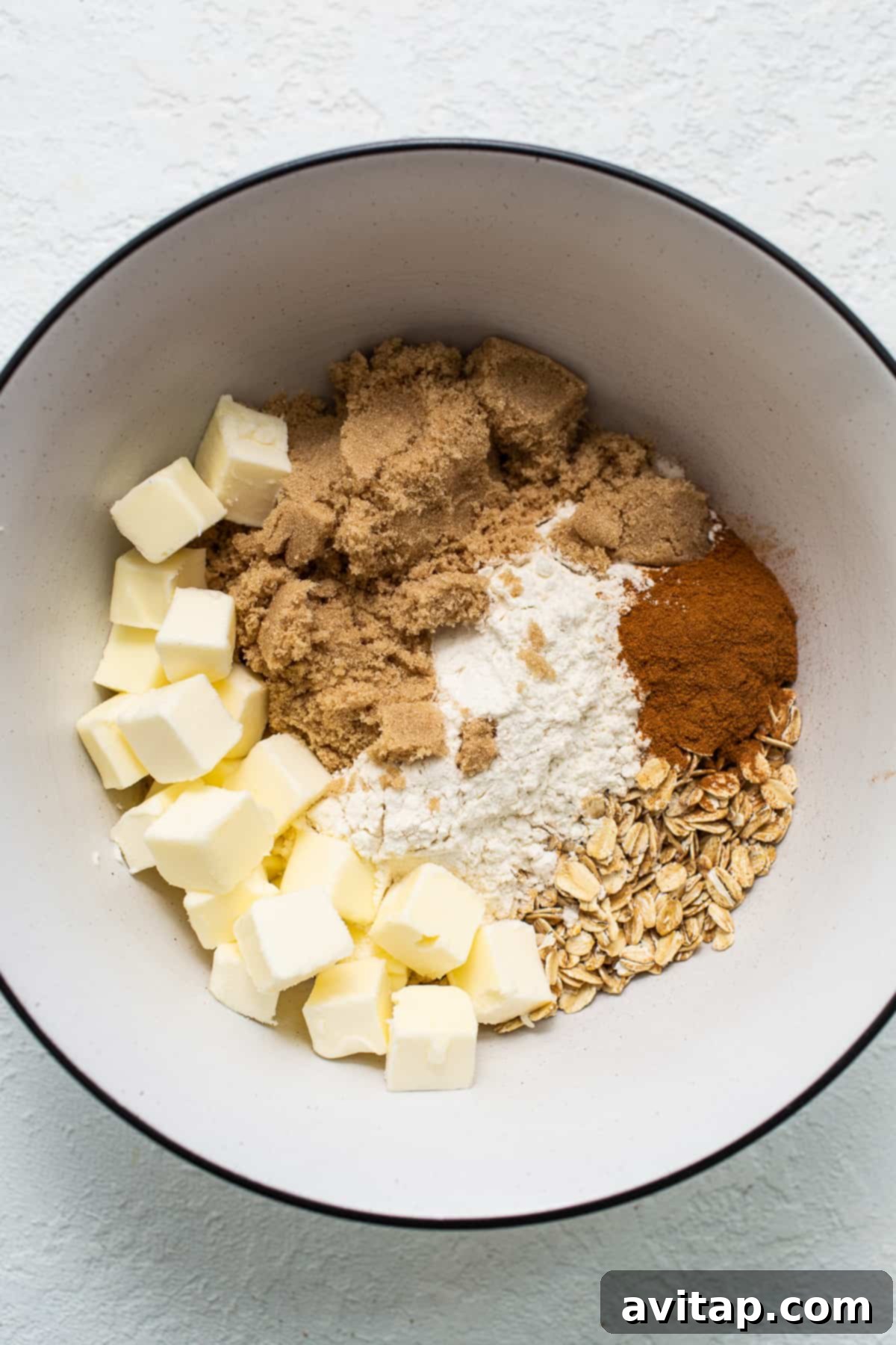 Ingredients for the crumbly streusel topping in a bowl, ready to be mixed.