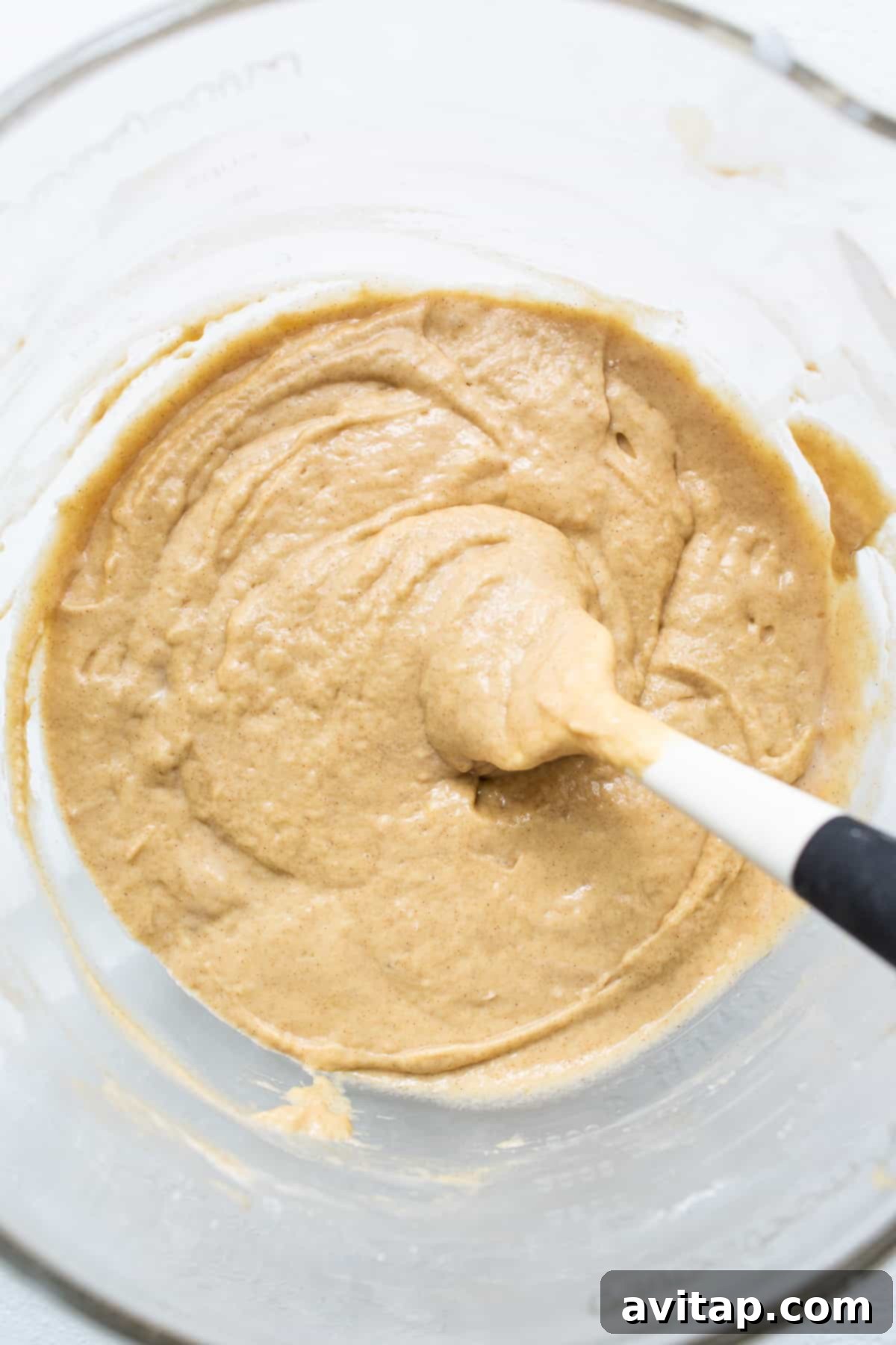 Coffee cake batter in a mixing bowl, smooth and ready for the next step.