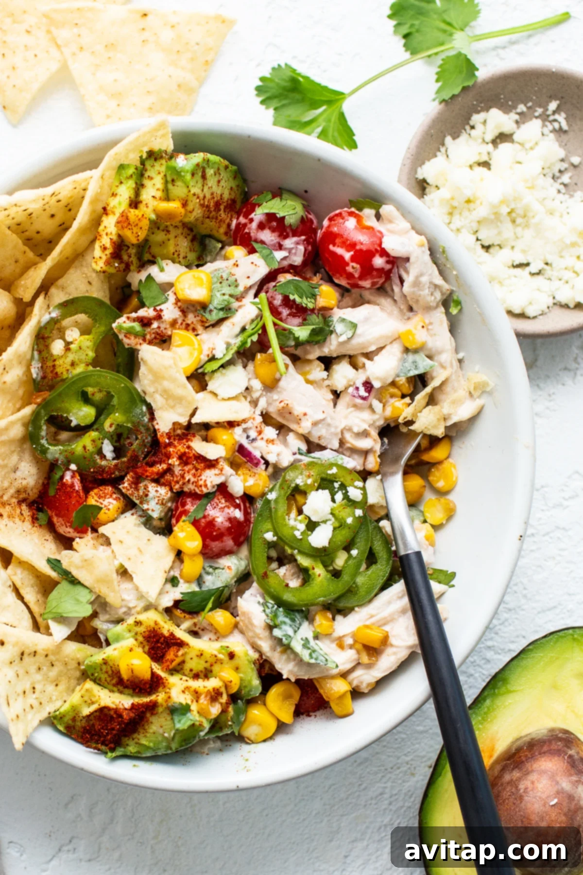 Street Corn Chicken Salad - Perfect for Meal Prep and Easy Storage A single serving of street corn chicken salad in a rustic ceramic bowl, ready to be enjoyed.