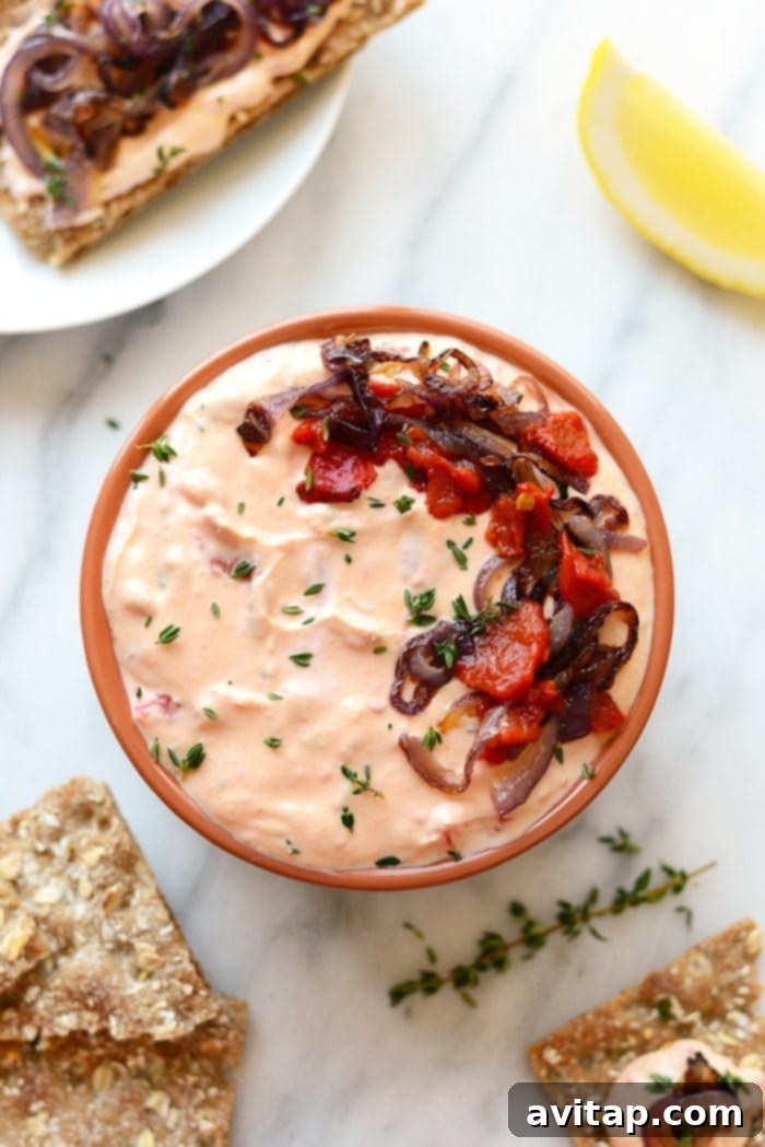 Roasted Red Pepper Goat Cheese Bliss 4 Close-up of the delectable Roasted Red Pepper and Goat Cheese Dip, showcasing its creamy texture and rich color. A perfect, healthy appetizer.
