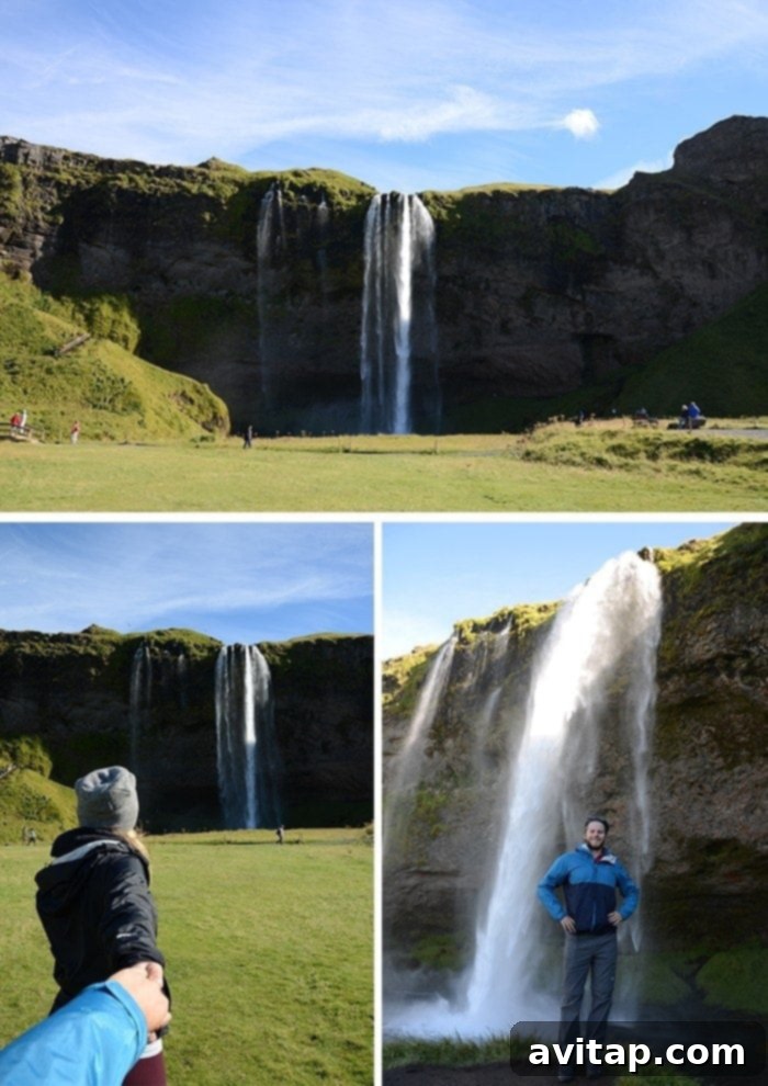 People walking behind the Seljalandsfoss waterfall in Iceland, capturing its unique perspective.