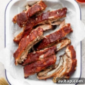 Oven baked ribs brushed with BBQ sauce, a great alternative if you don't have a grill.