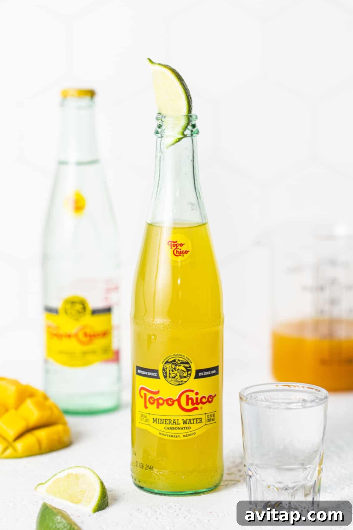 Refreshing Ranch Water in a Topo Chico Bottle A perfectly mixed Ranch Water in its Topo Chico bottle, garnished with a lime, ready to be enjoyed.