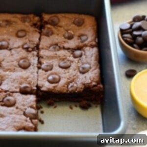 Cashew Butter Brownies with chocolate chips in a pan, a perfect healthy indulgence.