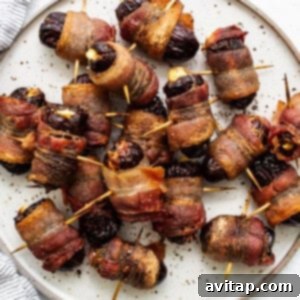 Finished bacon wrapped dates on a plate.