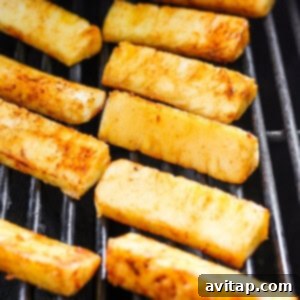 A close-up of some food on a grill.