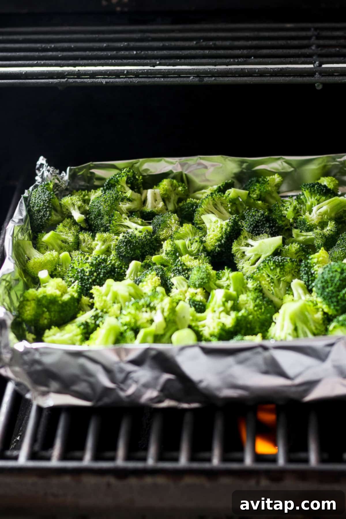 A tray of broccoli cooking in an oven, showcasing an alternative cooking method.