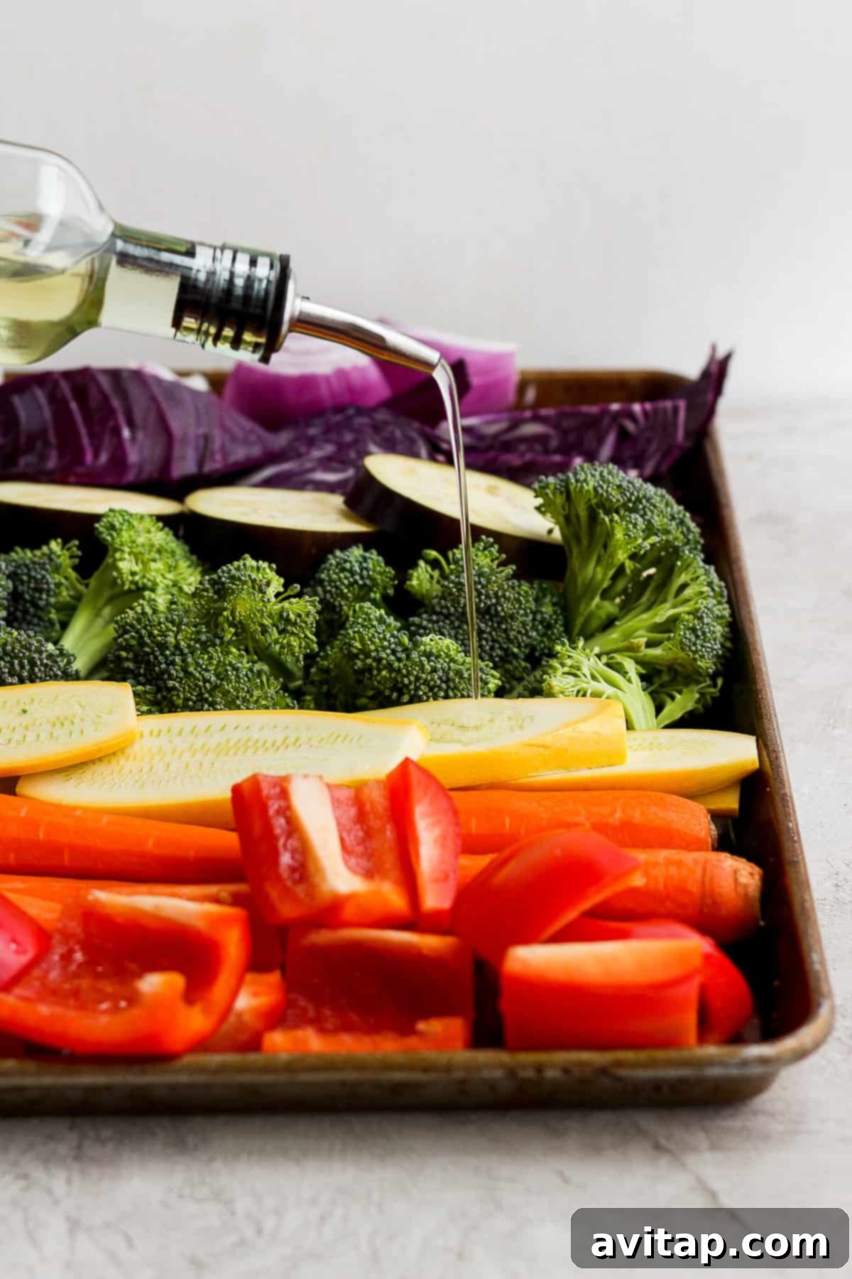 A festive tray of colorful grilled vegetables paired with a bottle of wine, perfect for a summer gathering.