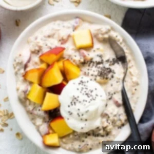 Dreamy Peach Overnight Oats 10 A bowl of oatmeal with peaches and yoghurt, ready to be served.