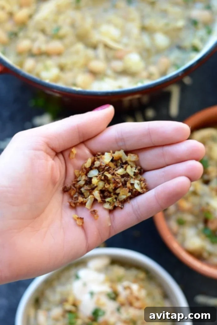 A vibrant and appetizing spread of White Chicken Quinoa Chili in bowls, alongside various toppings like fresh cilantro, Greek yogurt, and lime wedges, inviting diners to customize their meal.
