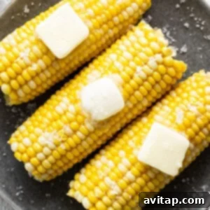 Corn on the cob with melting butter and salt.