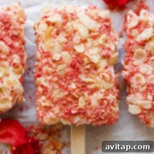 Three finished high-protein strawberry shortcake bars, garnished.