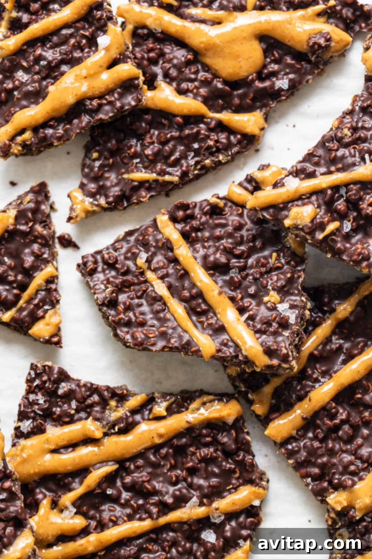 A close up of a bunch of chocolate quinoa crisps on a table.