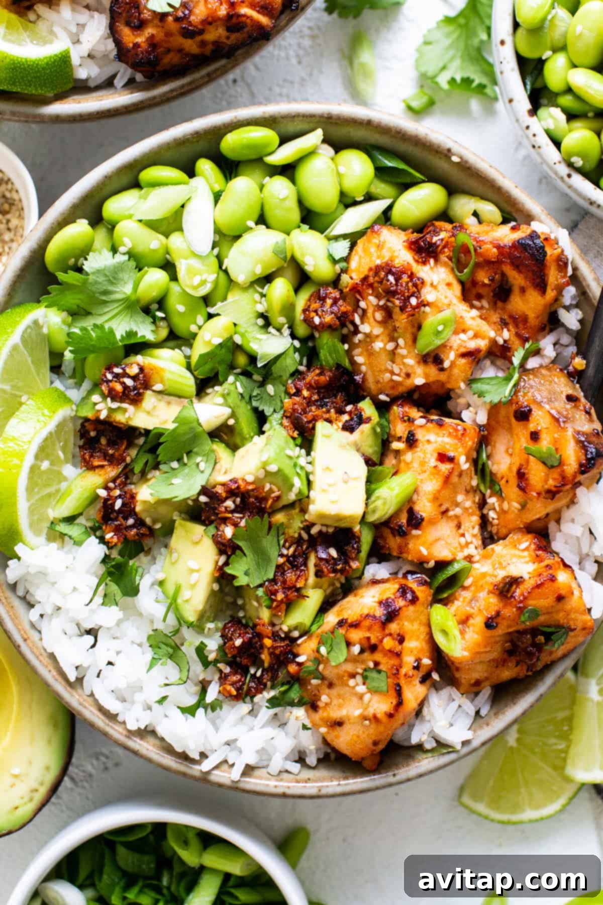 a bowl filled with rice, peas, and chicken.