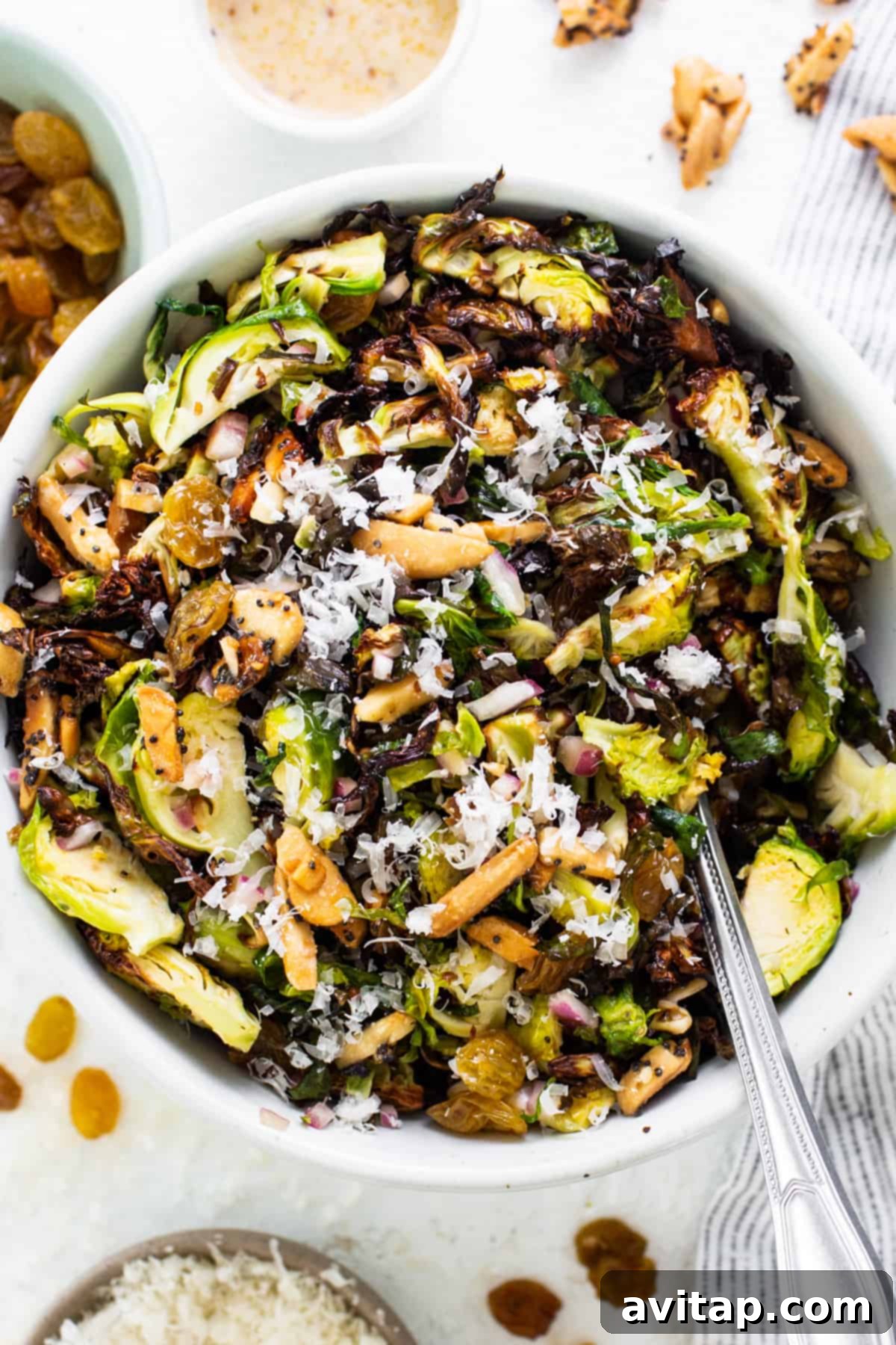 Crunchy Air Fried Brussels Salad 7 Brussels sprout salad in a white bowl.