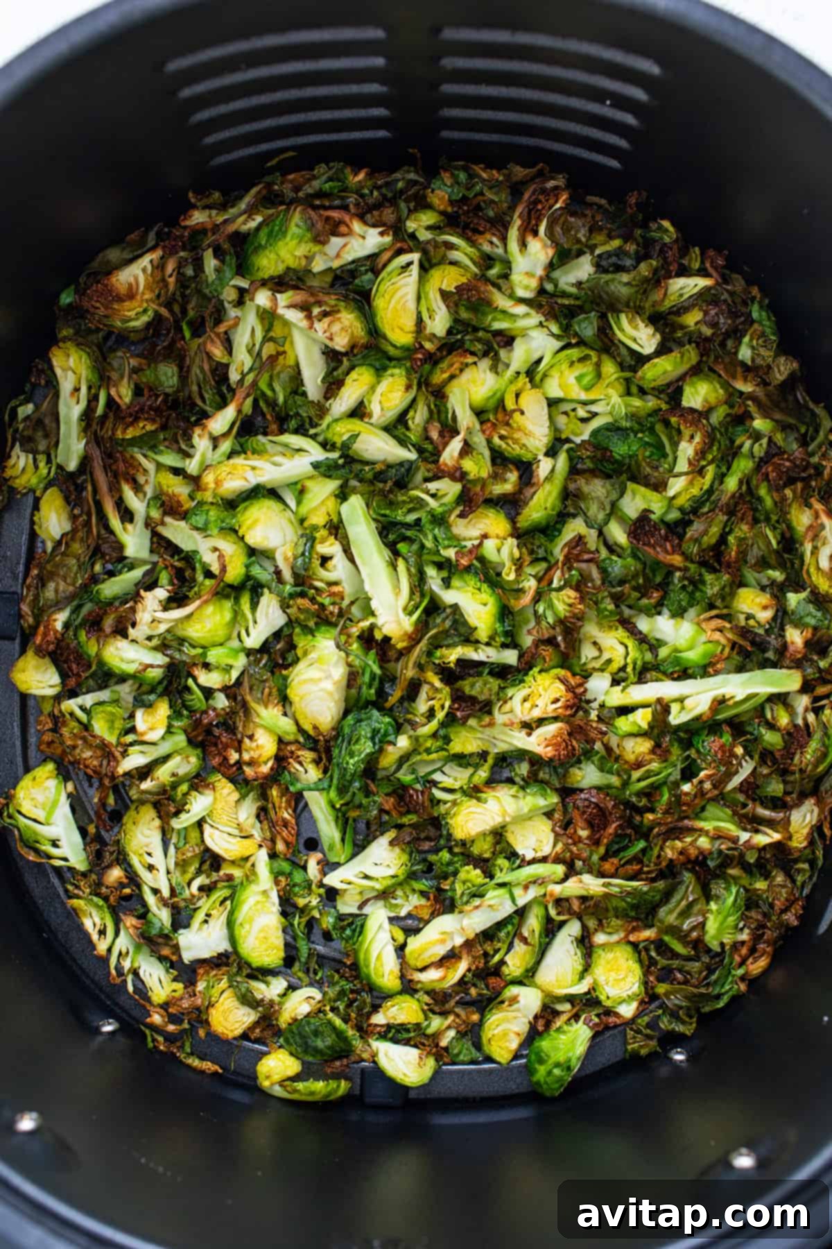 Crunchy Air Fried Brussels Salad 5 Brussels sprouts in an air fryer.