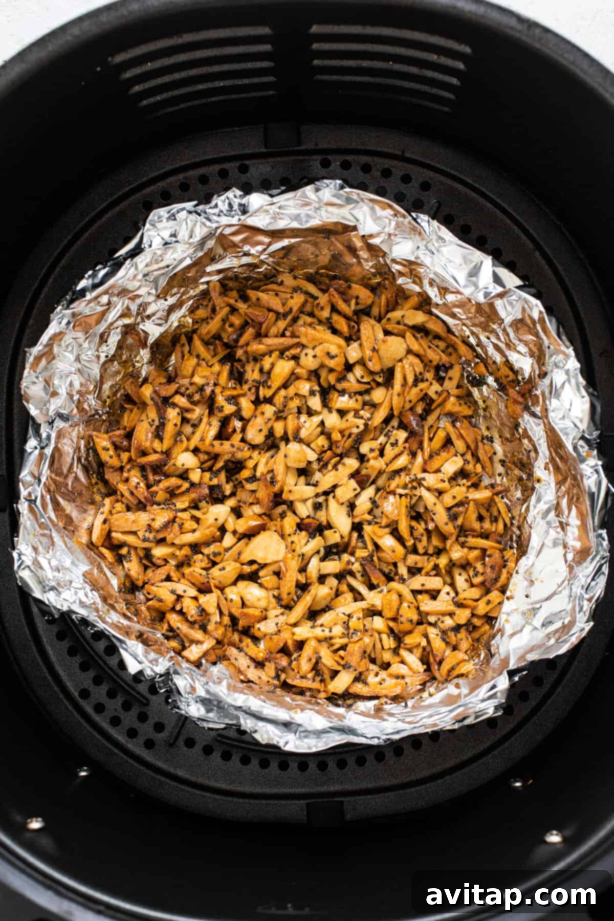 Crunchy Air Fried Brussels Salad 6 An air fryer filled with nuts.