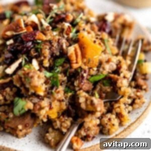 A serving of Quinoa Stuffing, perfectly fluffed and garnished, ready to be enjoyed.