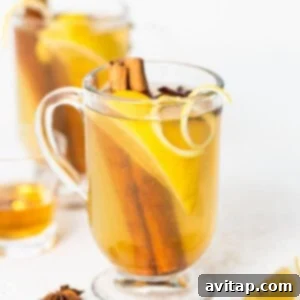 A comforting cup of lemon tea infused with cinnamon and star anise, ready to be enjoyed.