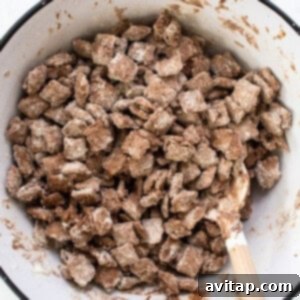 A bowl filled with a mixture of protein puppy chow, fully coated.