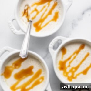 Three white bowls with caramel sauce on them.