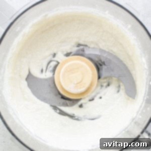 Smooth, creamy blended cottage cheese in a food processor.