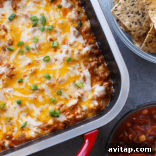 Cheesy Mexican dip in a baking dish.