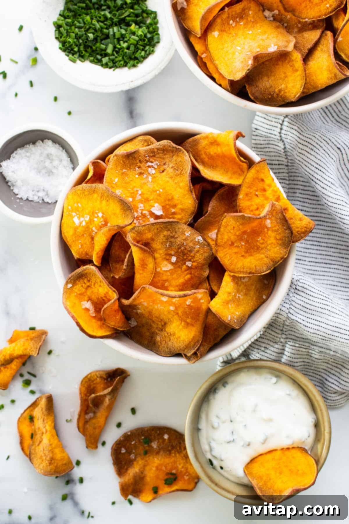 A generous bowl of homemade air fryer sweet potato chips, ready to be enjoyed.
