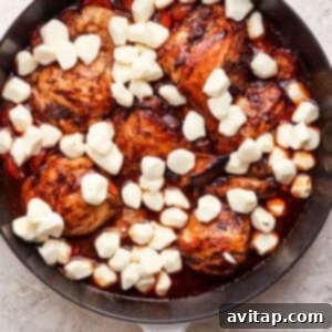 A pan with chicken and melted mozzarella cheese, fresh from the oven.