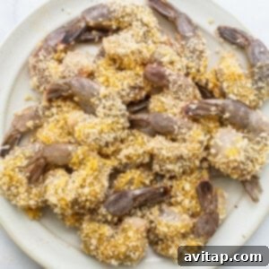Fried shrimp with sesame seeds on a plate.