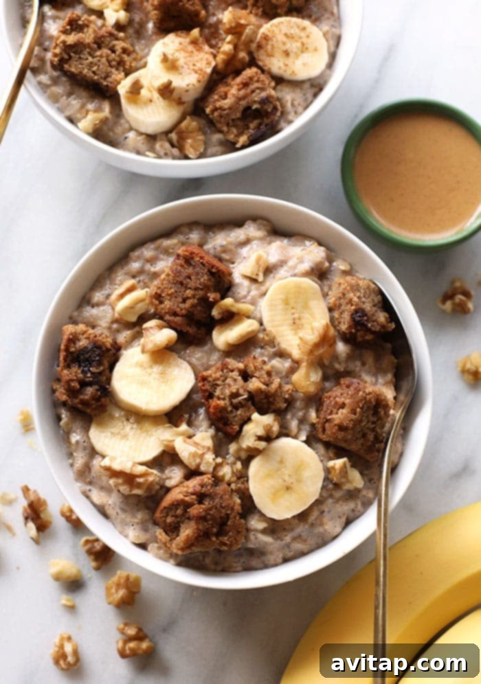 A beautifully presented bowl of fluffy banana stovetop oatmeal, garnished with fresh banana slices, walnuts, and a dusting of cinnamon, inviting a healthy and delicious breakfast.