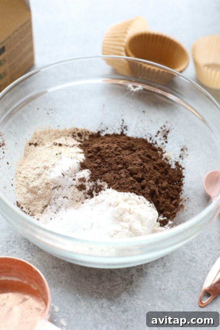 A bowl filled with the healthier chocolate cupcake ingredients, ready for mixing.