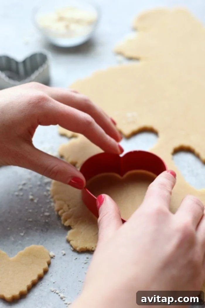 Beautifully cut-out shapes from healthy almond flour sugar cookie dough Cutting out healthy almond flour sugar cookies