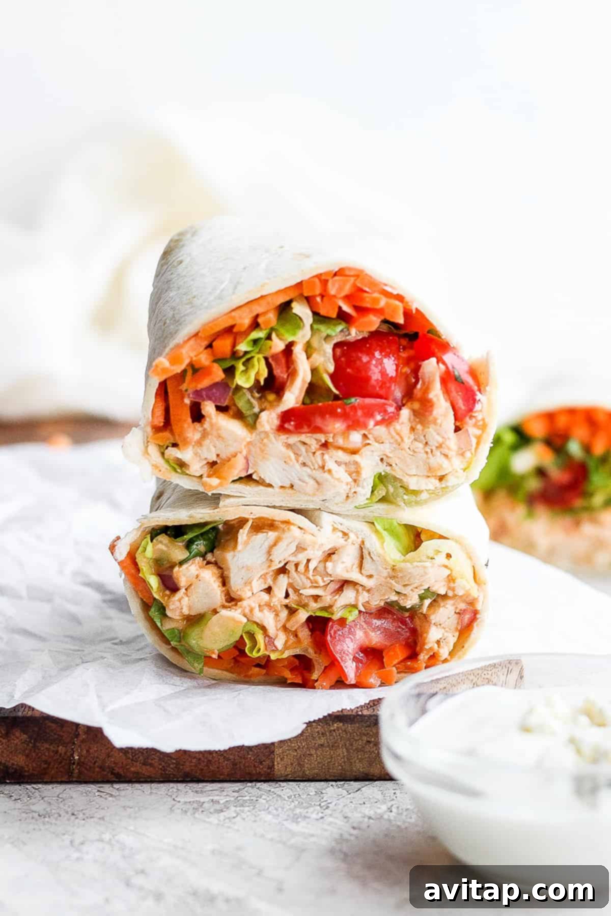 Stacked Buffalo Chicken Wraps ready to be enjoyed, showcasing fresh ingredients and a vibrant filling, perfect for a healthy and satisfying lunch