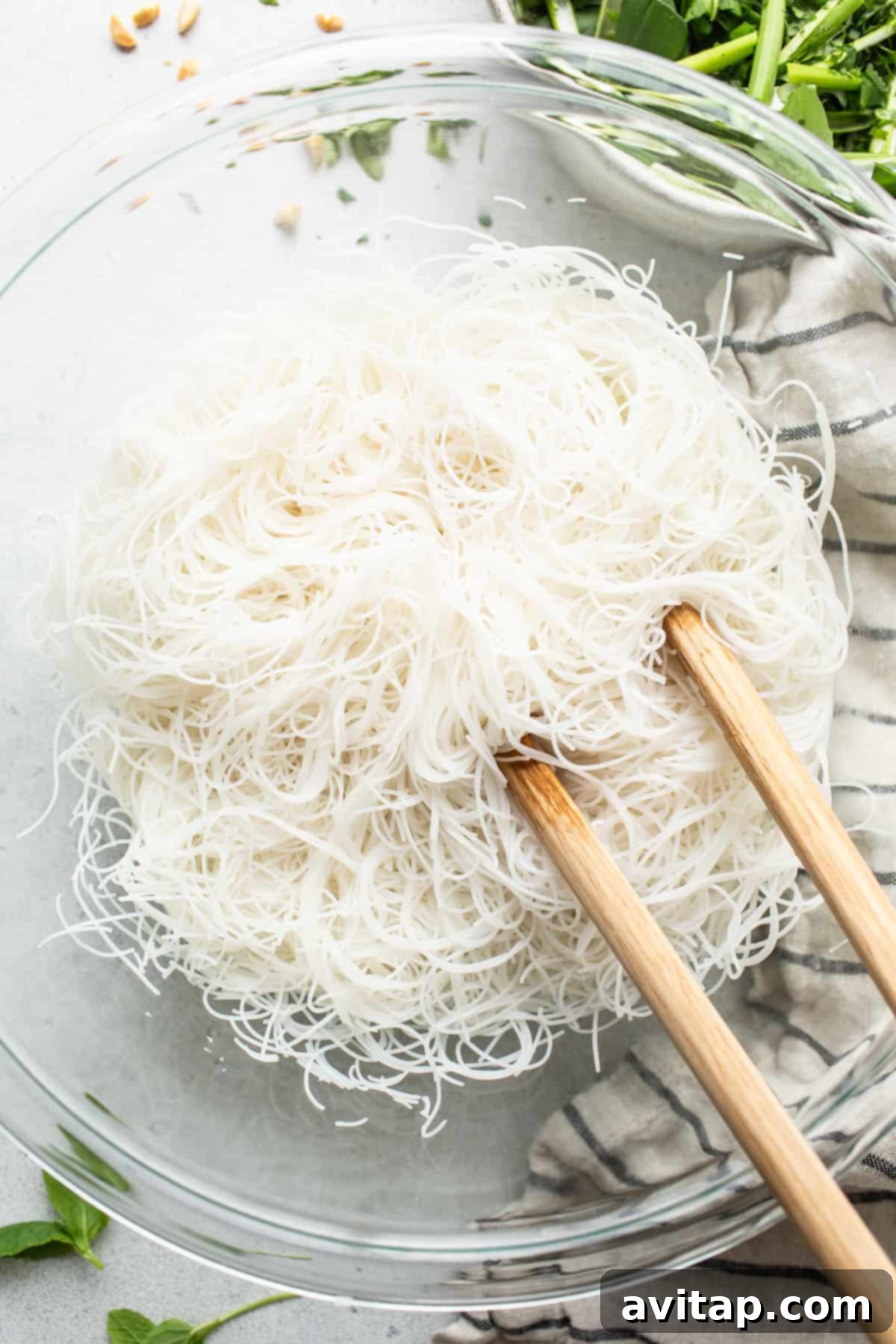 Noodles in a bowl with chopsticks.